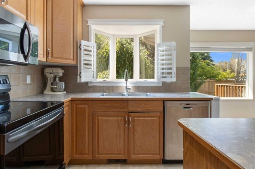 235 Everwillow Close Sw, Calgary, AB - Indoor Photo Showing Kitchen With Double Sink