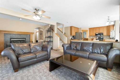 235 Everwillow Close Sw, Calgary, AB - Indoor Photo Showing Living Room With Fireplace