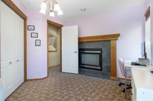 235 Everwillow Close Sw, Calgary, AB - Indoor With Fireplace