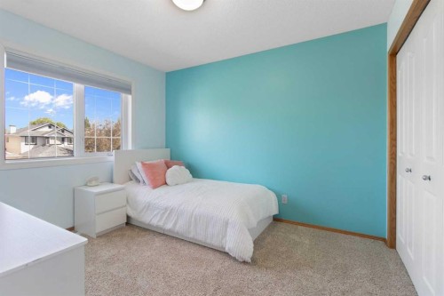 235 Everwillow Close Sw, Calgary, AB - Indoor Photo Showing Bedroom