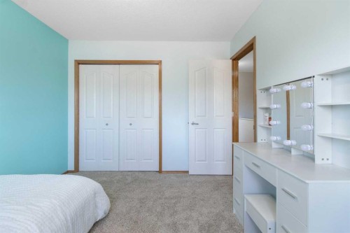 235 Everwillow Close Sw, Calgary, AB - Indoor Photo Showing Bedroom