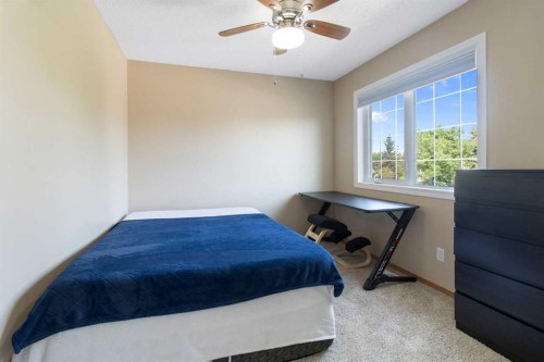 235 Everwillow Close Sw, Calgary, AB - Indoor Photo Showing Bedroom
