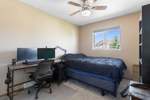 235 Everwillow Close Sw, Calgary, AB - Indoor Photo Showing Bedroom