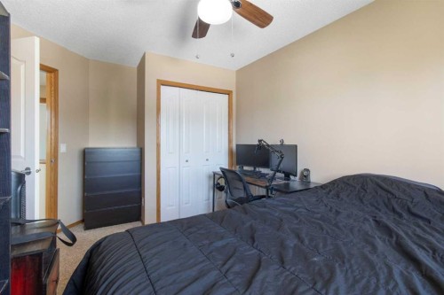 235 Everwillow Close Sw, Calgary, AB - Indoor Photo Showing Bedroom