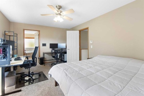 235 Everwillow Close Sw, Calgary, AB - Indoor Photo Showing Bedroom
