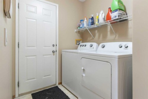 235 Everwillow Close Sw, Calgary, AB - Indoor Photo Showing Laundry Room