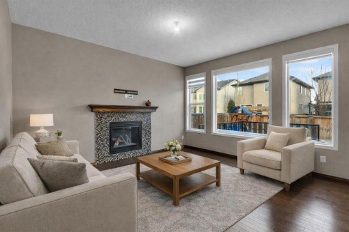 2235 Brightoncrest Green Se, Calgary, AB - Indoor Photo Showing Living Room With Fireplace