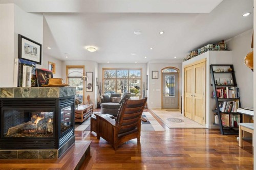2407 Westmount Road Nw, Calgary, AB - Indoor Photo Showing Living Room With Fireplace