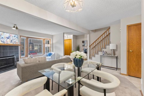 182 Riverglen Park Se, Calgary, AB - Indoor Photo Showing Living Room With Fireplace