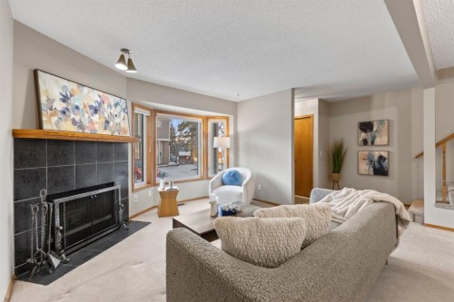 182 Riverglen Park Se, Calgary, AB - Indoor Photo Showing Living Room With Fireplace