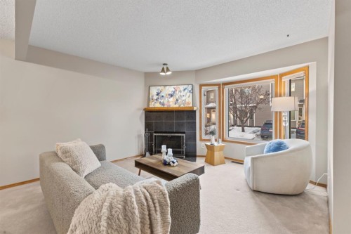 182 Riverglen Park Se, Calgary, AB - Indoor Photo Showing Living Room With Fireplace