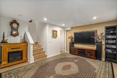 76 Sunlake Gardens Se, Calgary, AB - Indoor With Fireplace