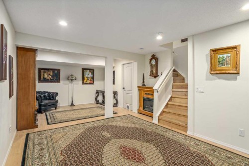 76 Sunlake Gardens Se, Calgary, AB - Indoor Photo Showing Other Room With Fireplace