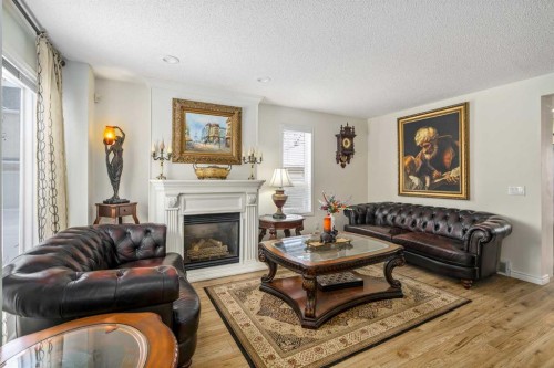 76 Sunlake Gardens Se, Calgary, AB - Indoor Photo Showing Living Room With Fireplace