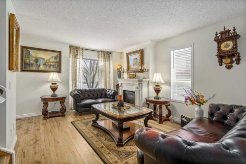 76 Sunlake Gardens Se, Calgary, AB - Indoor Photo Showing Living Room With Fireplace