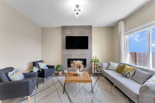 521 Corner Meadows Way Ne, Calgary, AB - Indoor Photo Showing Living Room With Fireplace