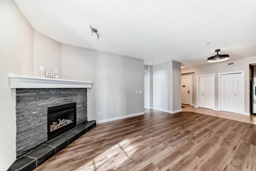 110-1005A Westmount Drive, Strathmore, AB - Indoor Photo Showing Living Room With Fireplace