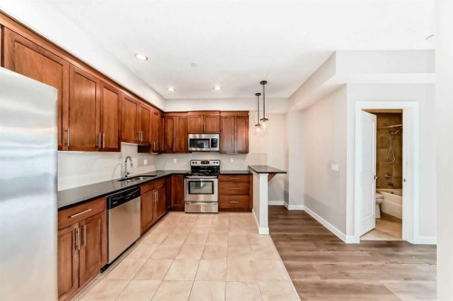110-1005A Westmount Drive, Strathmore, AB - Indoor Photo Showing Kitchen