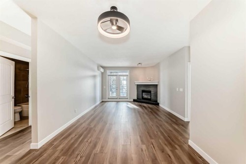 110-1005A Westmount Drive, Strathmore, AB - Indoor With Fireplace