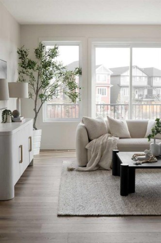 88 Sunrise Heath, Cochrane, AB - Indoor Photo Showing Living Room
