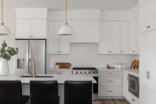 88 Sunrise Heath, Cochrane, AB - Indoor Photo Showing Kitchen With Upgraded Kitchen