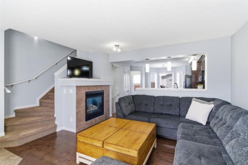 96 Auburn Bay Boulevard Se, Calgary, AB - Indoor Photo Showing Living Room With Fireplace