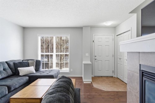 96 Auburn Bay Boulevard Se, Calgary, AB - Indoor Photo Showing Living Room With Fireplace