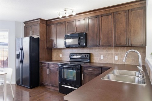 96 Auburn Bay Boulevard Se, Calgary, AB - Indoor Photo Showing Kitchen With Double Sink