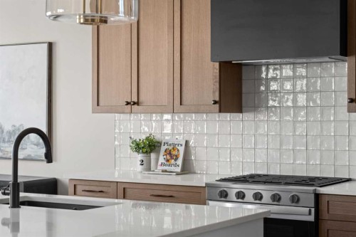47 Sundown Crescent, Cochrane, AB - Indoor Photo Showing Kitchen With Upgraded Kitchen