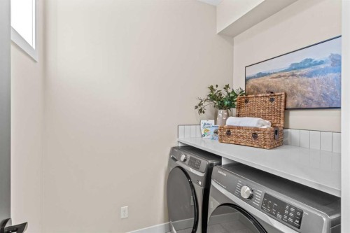 47 Sundown Crescent, Cochrane, AB - Indoor Photo Showing Laundry Room