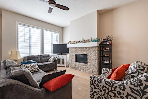80 Mahogany Gardens Se, Calgary, AB - Indoor Photo Showing Living Room With Fireplace