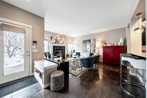 78 Ypres Green Sw, Calgary, AB - Indoor With Fireplace