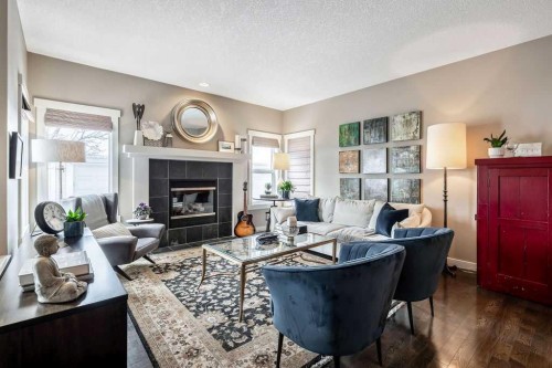 78 Ypres Green Sw, Calgary, AB - Indoor Photo Showing Living Room With Fireplace