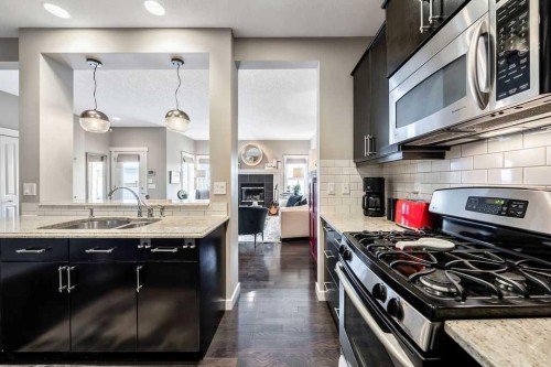 78 Ypres Green Sw, Calgary, AB - Indoor Photo Showing Kitchen With Double Sink With Upgraded Kitchen