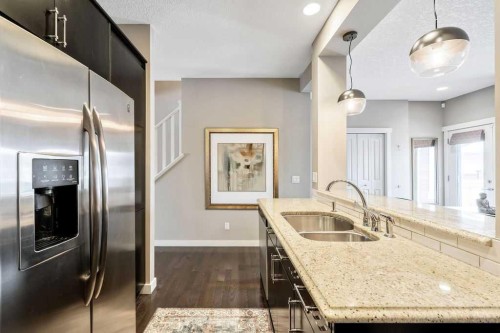 78 Ypres Green Sw, Calgary, AB - Indoor Photo Showing Kitchen With Stainless Steel Kitchen With Double Sink With Upgraded Kitchen