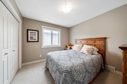 78 Ypres Green Sw, Calgary, AB - Indoor Photo Showing Bedroom
