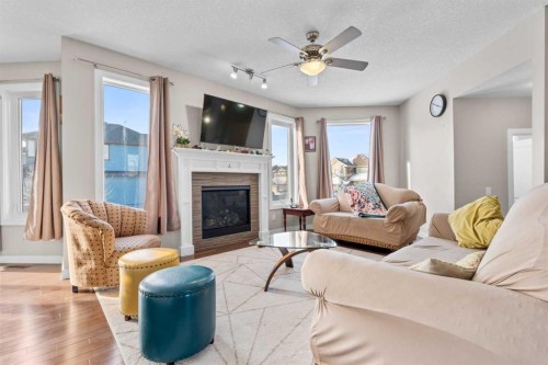 8487 Saddlebrook Drive Ne, Calgary, AB - Indoor Photo Showing Living Room With Fireplace