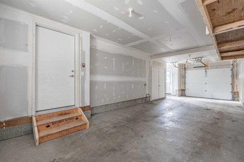 101-550 Seton Circle Se, Calgary, AB - Indoor Photo Showing Garage