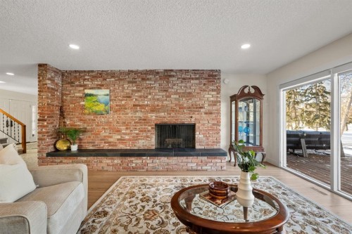 456 Wilderness Drive Se, Calgary, AB - Indoor Photo Showing Living Room With Fireplace