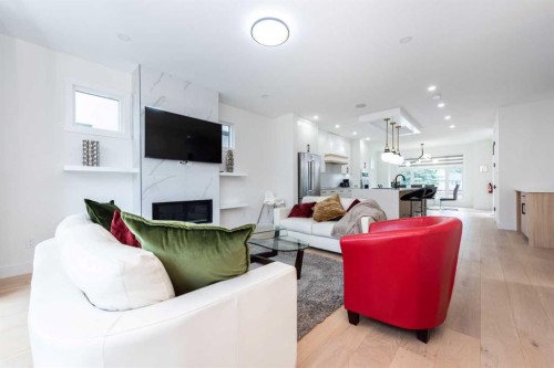31 Harvard Street Nw, Calgary, AB - Indoor Photo Showing Living Room With Fireplace