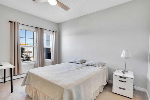 208-402 Marquis Lane Se, Calgary, AB - Indoor Photo Showing Bedroom