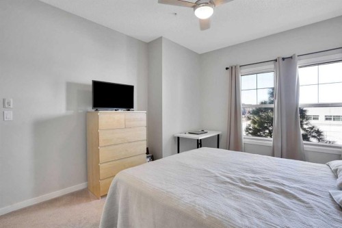 208-402 Marquis Lane Se, Calgary, AB - Indoor Photo Showing Bedroom
