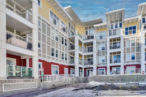 208-402 Marquis Lane Se, Calgary, AB - Outdoor With Balcony With Facade
