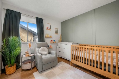 55 Coach Gate Way Sw, Calgary, AB - Indoor Photo Showing Bedroom