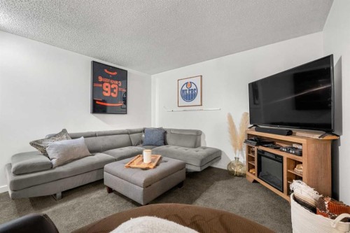 55 Coach Gate Way Sw, Calgary, AB - Indoor Photo Showing Living Room