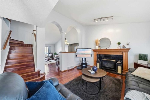 263 Coral Keys Drive Ne, Calgary, AB - Indoor Photo Showing Living Room With Fireplace