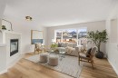 187 Elgin Way Se, Calgary, AB  - Indoor Photo Showing Living Room With Fireplace 