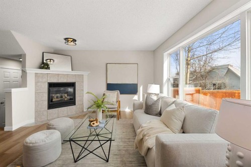 187 Elgin Way Se, Calgary, AB - Indoor Photo Showing Living Room With Fireplace