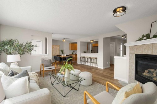 187 Elgin Way Se, Calgary, AB - Indoor Photo Showing Living Room With Fireplace