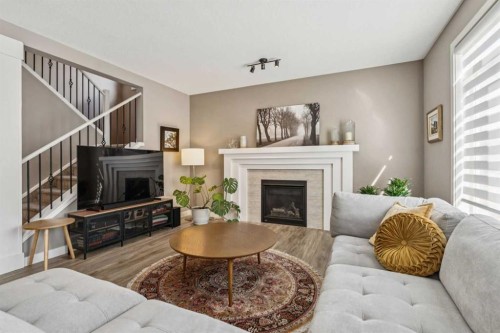 21 Riviera Point, Cochrane, AB - Indoor Photo Showing Living Room With Fireplace